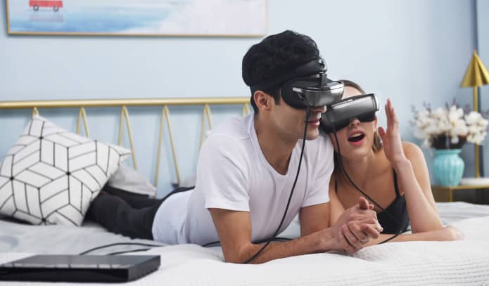 Couple using vr headsets